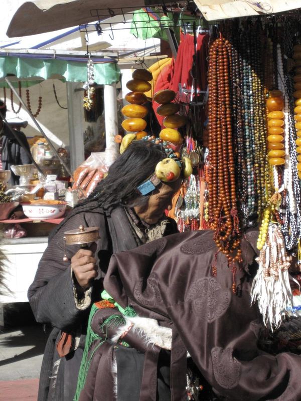 A pilgrim with a prayer wheel